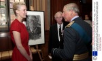 Louise stands next to her portrait and chats to HRH Prince Charles